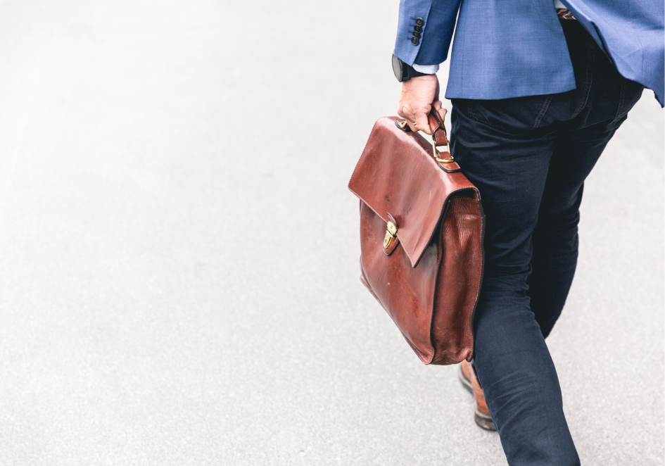 A guy walking with a bag